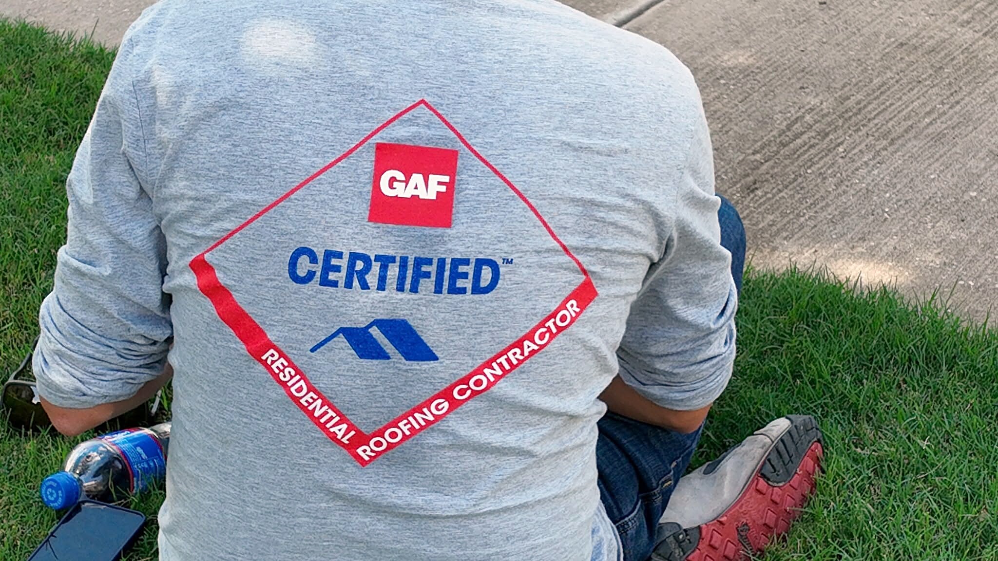 The back of a work shirt carrying the GAF Certified Residential Roofing Contractor mark